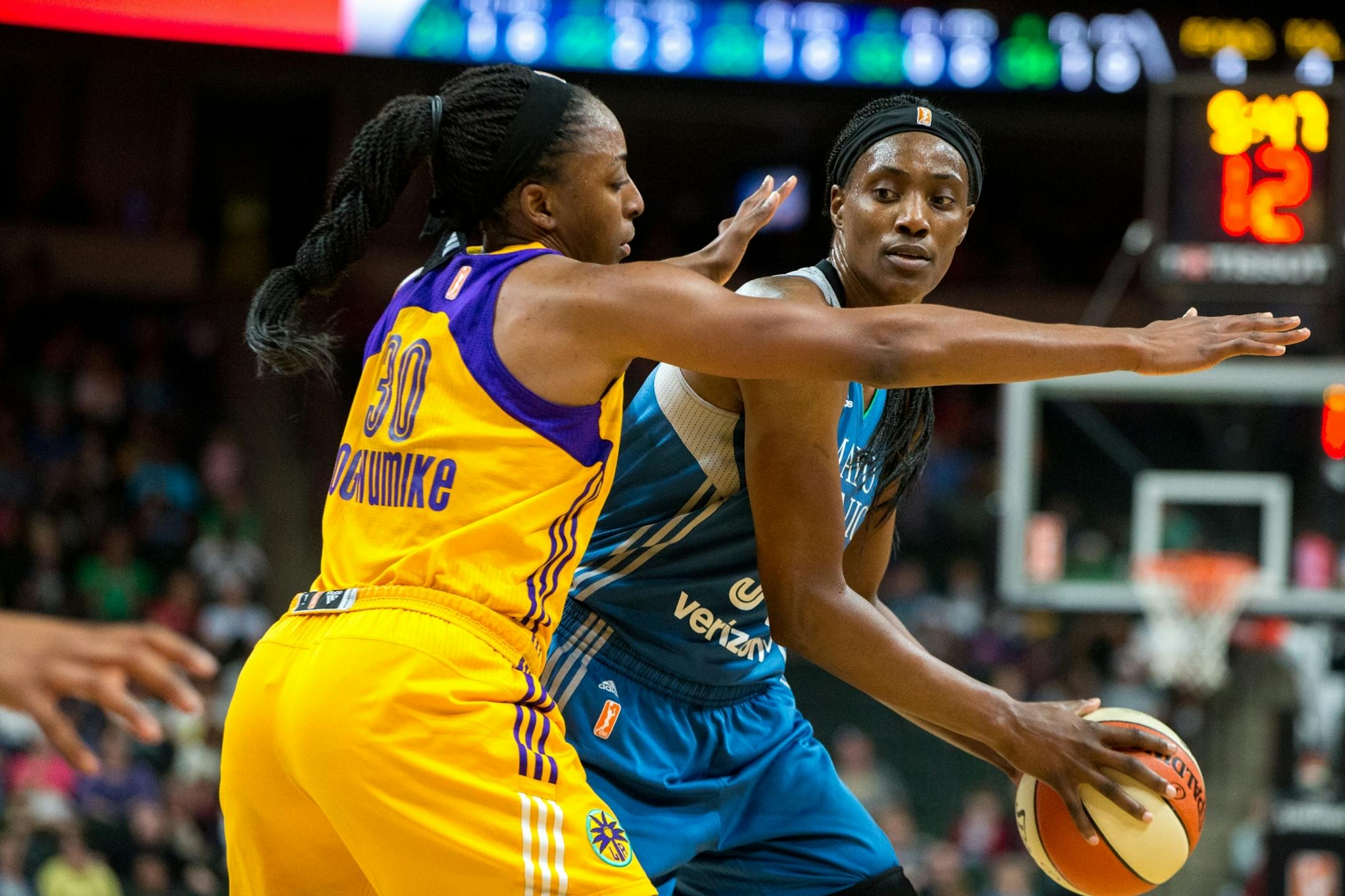 Minnesota Lynx center Sylvia Fowles looks to past Los Angeles Sparks' Nneka Ogwumike during the second half on Friday, Aug. 11, 2017, at Xcel Energy Center.
