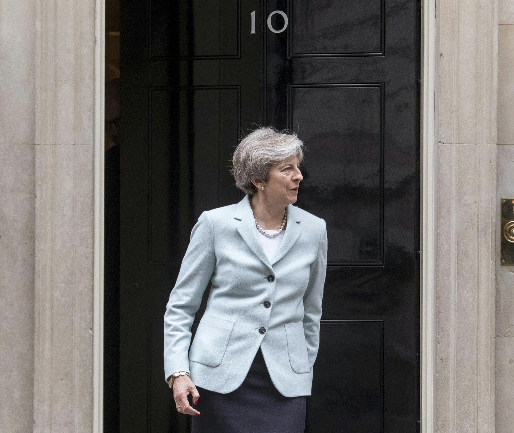 Britian's Prime Minister Theresa May prepares to welcome the First Minister of Wales, Carwyn Jones, to 10 Downing Street in London, ahead of talks, Monday Oct. 30, 2017. May is calling for changes in Parliamentary grievance procedures dealing with allegations against lawmakers, responding to suggestions that some U.K. lawmakers may have sexually harassed their employees. (Victoria Jones/PA via AP)