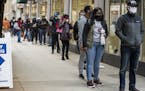 Hundreds of people wait in line to early vote at the Loop Super Site, Thursday morning, Oct. 1, 2020, in Chicago. Voters on Thursday say they understa