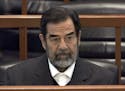 FILE - In this Dec. 6, 2006 file photo, former Iraq leader Saddam Hussein sits in court in Baghdad, Iraq, during the "Anfal" trial against him. Republ