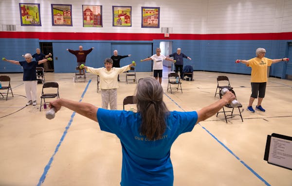 Karlene Niva-Colgan leads the Fit &amp; Fabulous exercise class held by Keystone Community Services at the West 7th Community Center in St. Paul, Minn