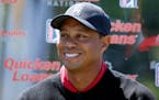 FILE - In this May 16, 2016, file photo, Tiger Woods pauses during a Quicken Loans National golf tournament media availability on the 10th tee at Cong