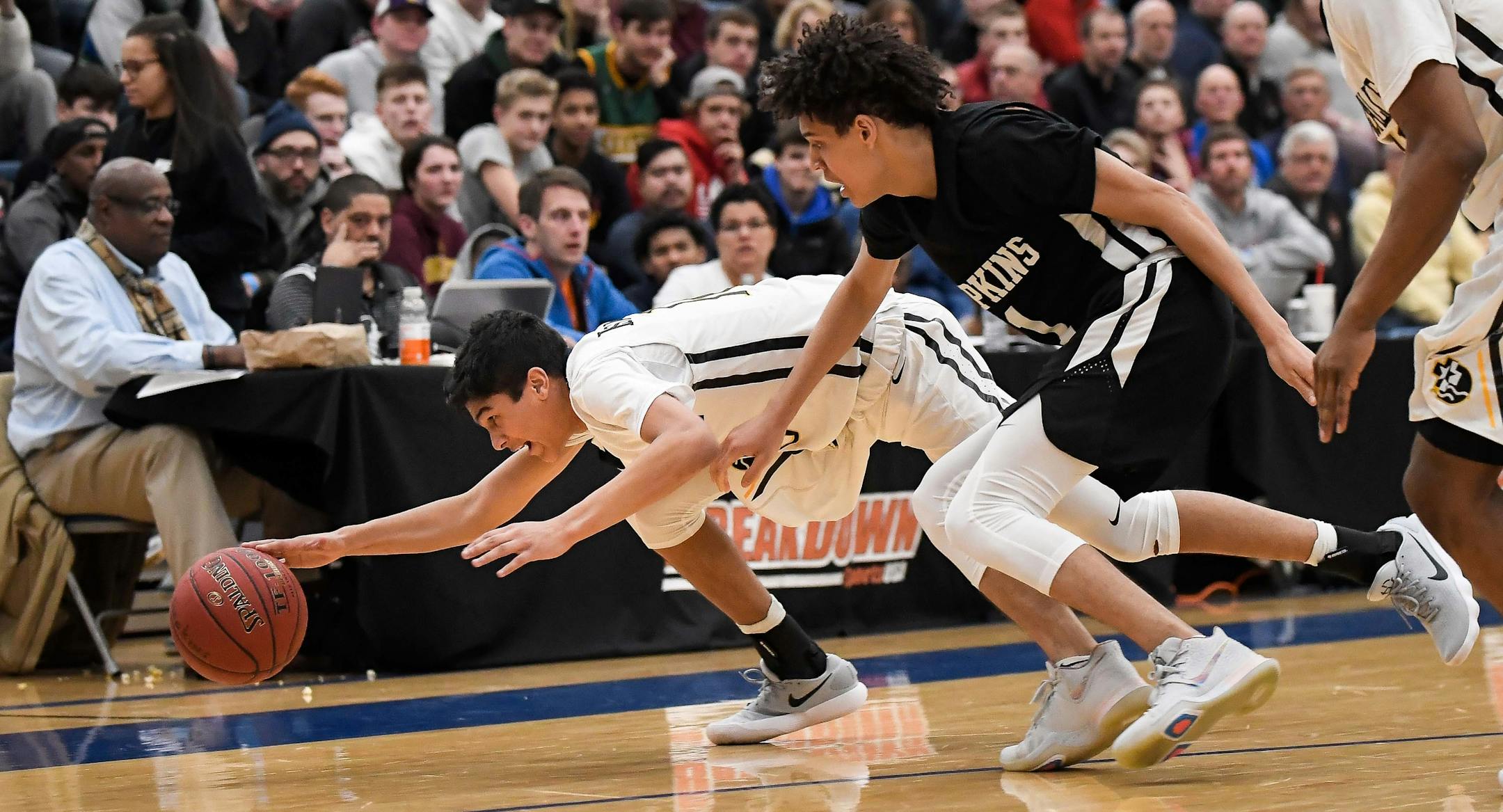 DeLaSalle guard Tyrell Terry (10) dove for a loose ball against Hopkins last season.