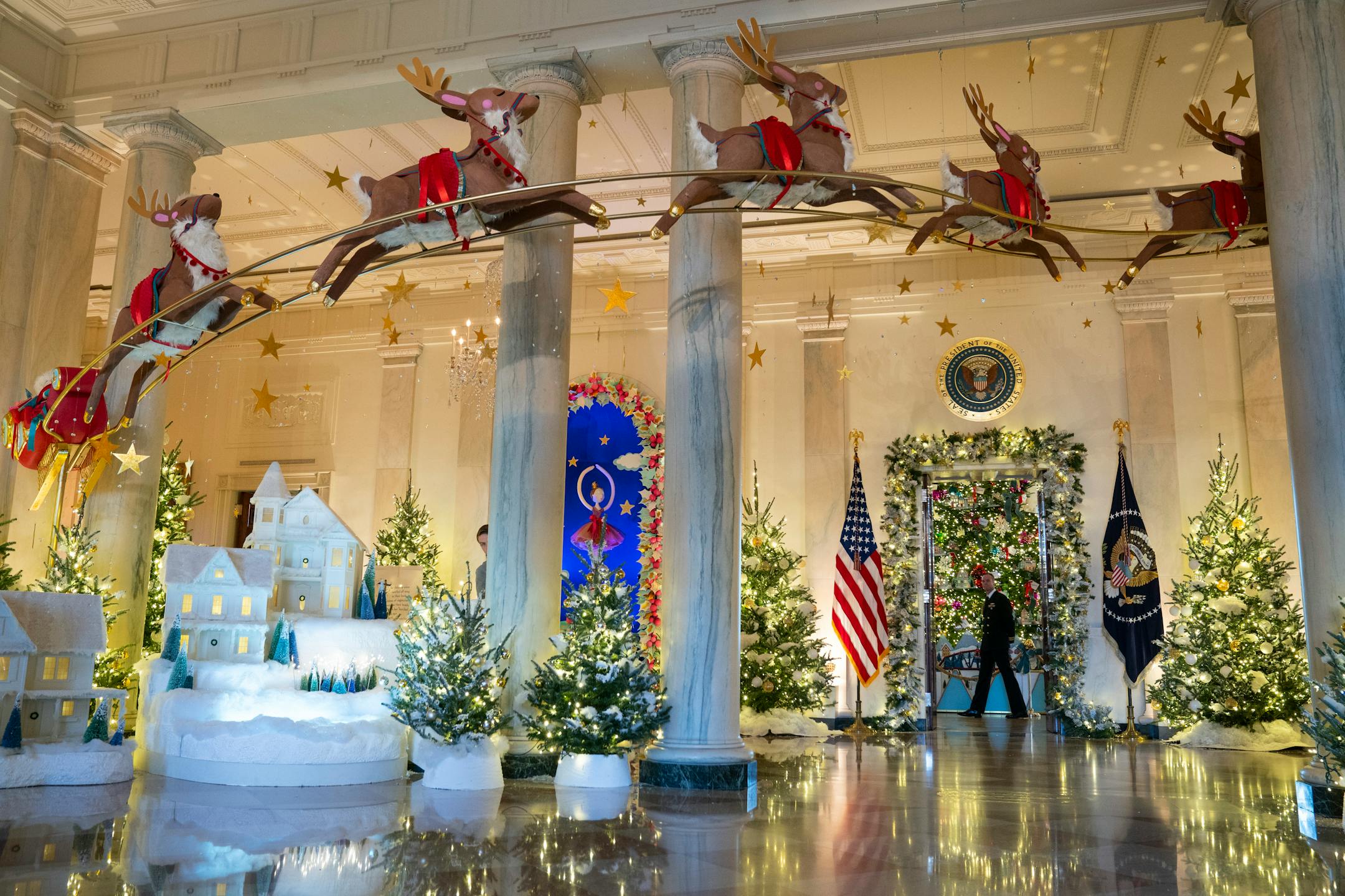 Holiday decorations adorn the Grand Foyer of the White House for the 2023 theme "Magic, Wonder, and Joy," Monday, Nov. 27, 2023, in Washington. (AP Photo/Evan Vucci)