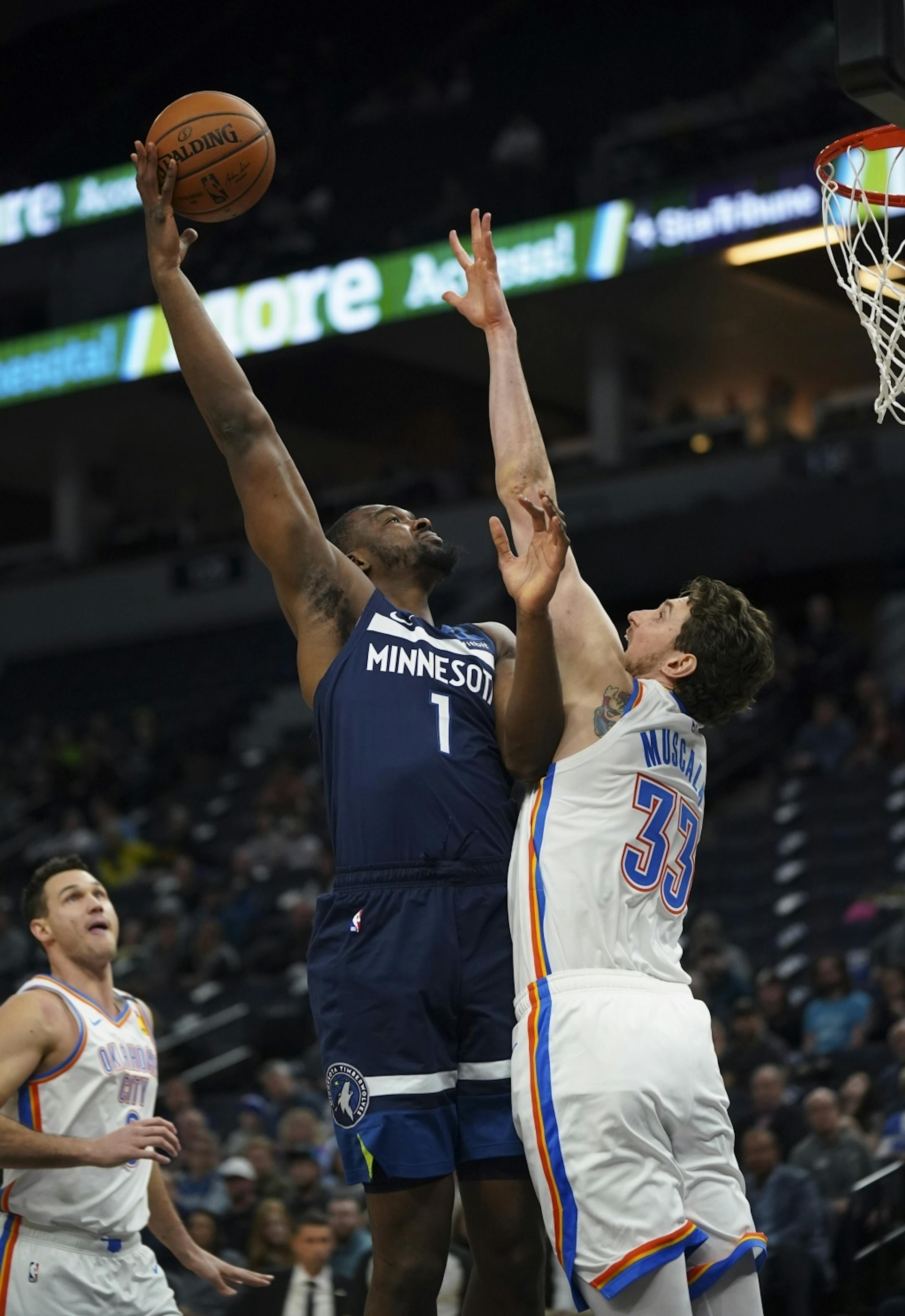 Minnesota Timberwolves forward Noah Vonleh (1) shot over Oklahoma City Thunder forward Mike Muscala (33) in the first half.