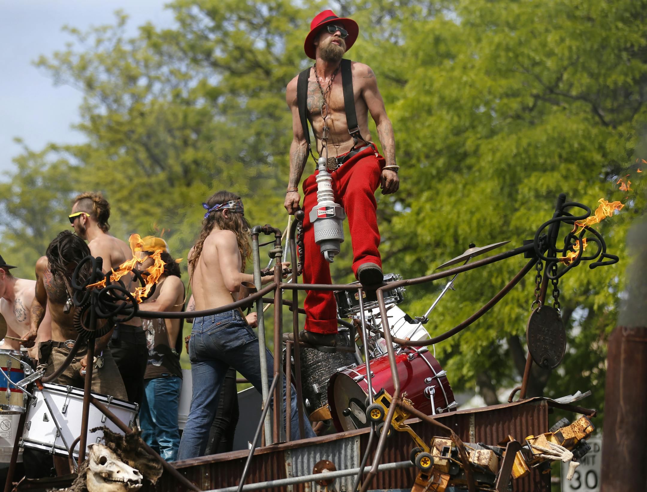 At the May Day Parade in Minneapolis held on Bloomington Ave South, artist Matt Carlyle danced to the drums and spouting flames aboard the Art Shanty.] rtsong-taatarii@startribune.com, Matt Carlyle(vq) ORG XMIT: MIN2014042917082369
