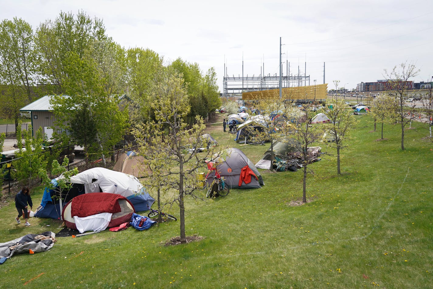 Over the past month, a small camp consisting of about a dozen tents on a narrow stretch of land along Hiawatha Avenue has swelled to more than 100 homeless men and women. ] Shari L. Gross • shari.gross@startribune.com What began in March as a small camp consisting of about a couple dozen homeless adults has now swelled to more than 100 residents in tents. Known as "Camp Quarantine," the fast-growing encampment has raised alarms over the health of the camp residents amid the coronavirus pandemic.