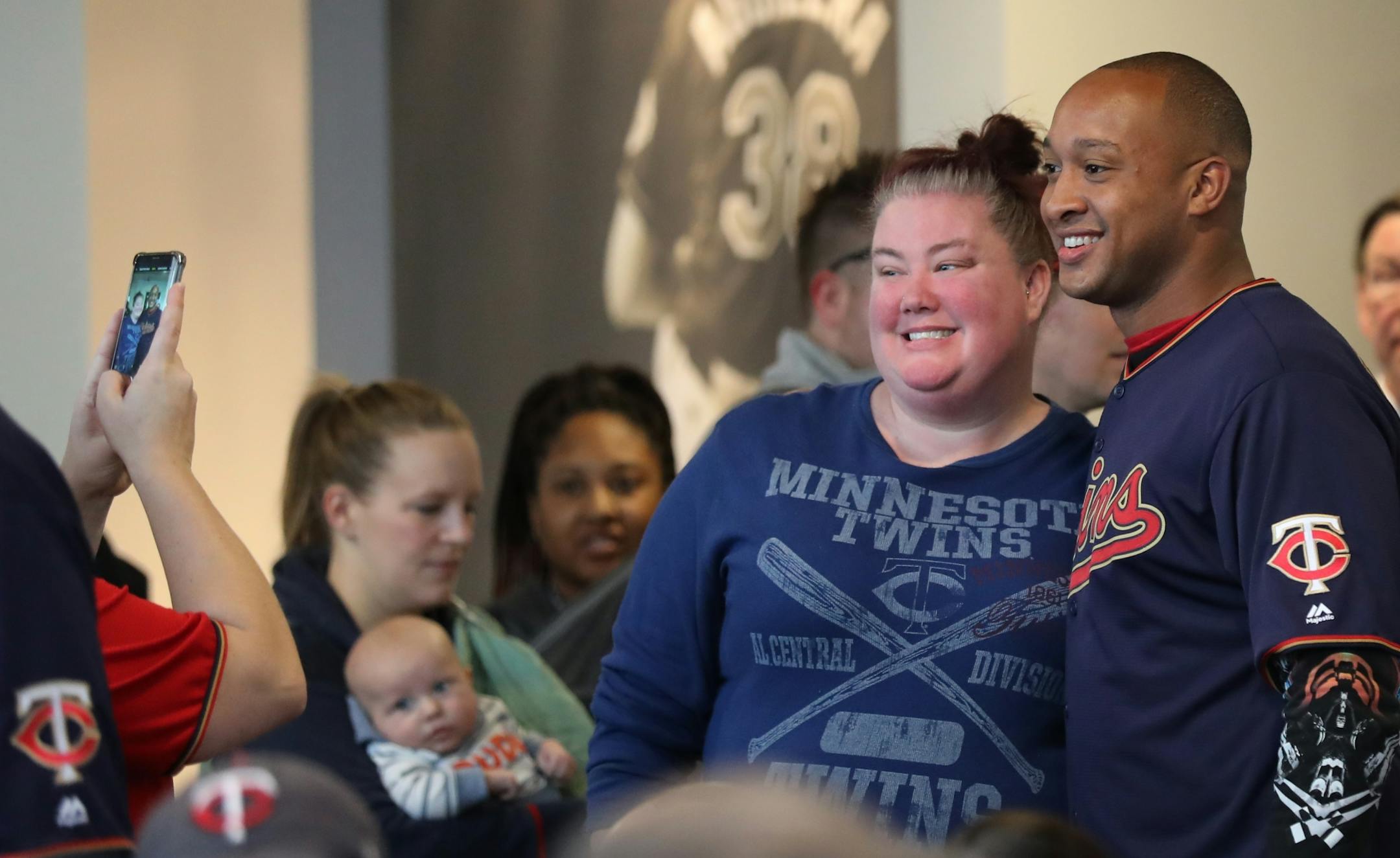 Newly acquired infielder Jonathan Schoop stopped for a photo with a fan before a roundtable discussion at TwinsFest.