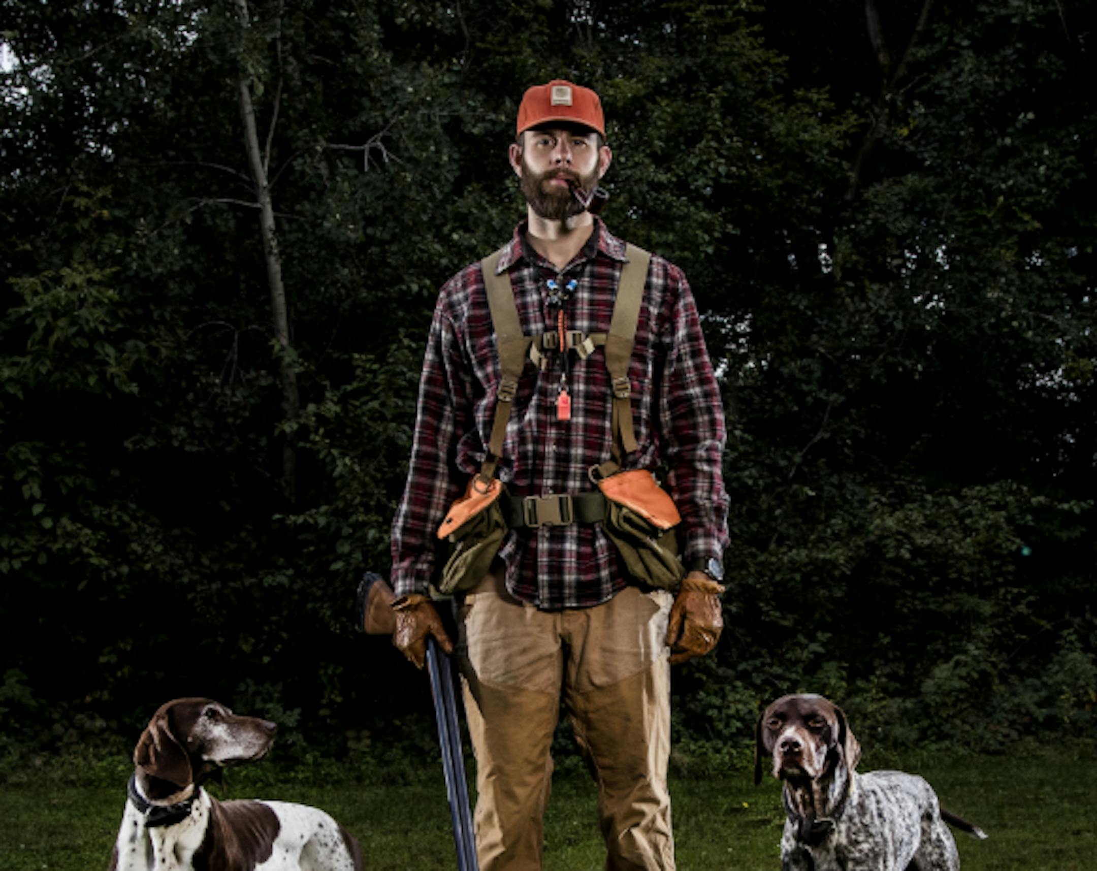 Garrett Mikrut, with his German shorthaired pointers, Stella and Surly.