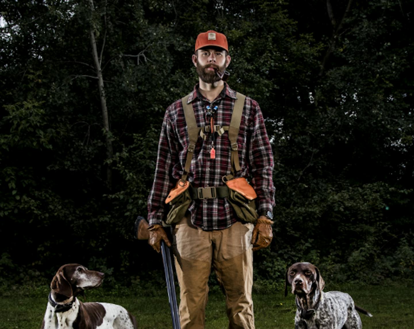 Garrett Mikrut, with his German shorthaired pointers, Stella and Surly.