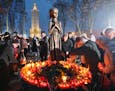 Candles are placed around a monument to victims of the Great Famine in Kiev, Ukraine, in 2009. The famine in Soviet Ukraine killed millions of people 