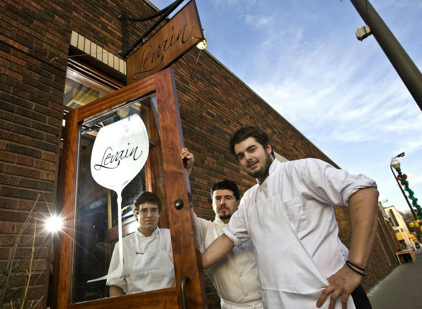 TOM WALLACE � twallace@startribune.com Assign# 00006737A slug_rn0219 Date: Feb 8, 2009 Caf� Levain on 48th and Chicago. The chef team from left is Cook Alan Hlebaen, Sous Chef Remle Colestock and Chef Adam Vickerman, at the door on a Sunday night.___Sunday Night dinners around the Twin Cities That bring taste and price to a place, it make Sunday night dining a pleasure. Three restaurants are photographed.