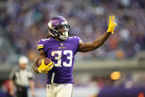 Vikings running back Dalvin Cook held up two fingers to signify his second touchdown of the game after his 21 yard scoring run in the fourth quarter.