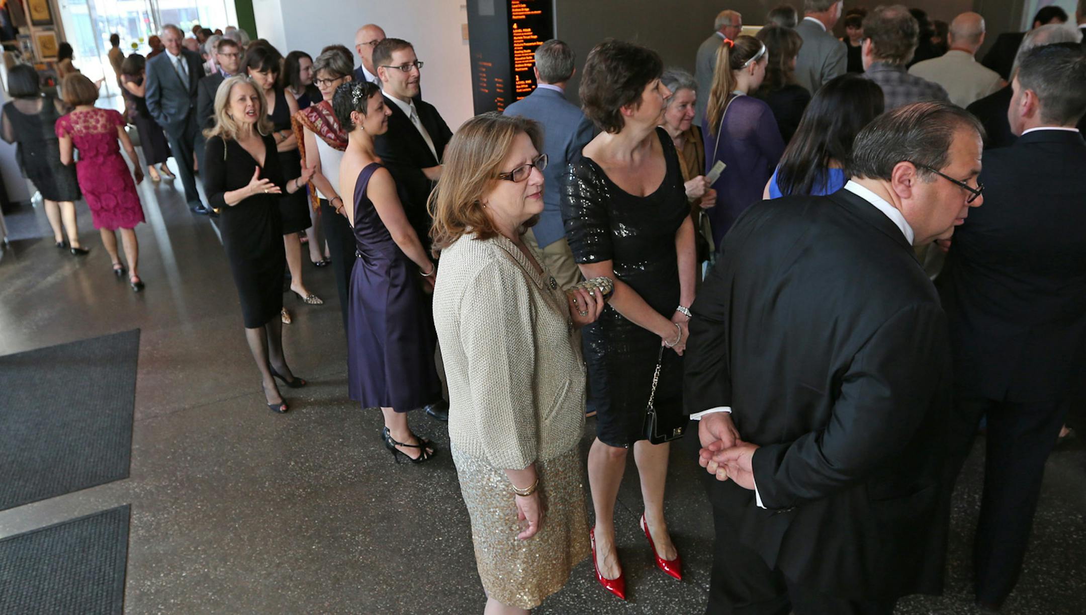 People waited in line for admission to the Guthrie 50th Anniversary celebration.