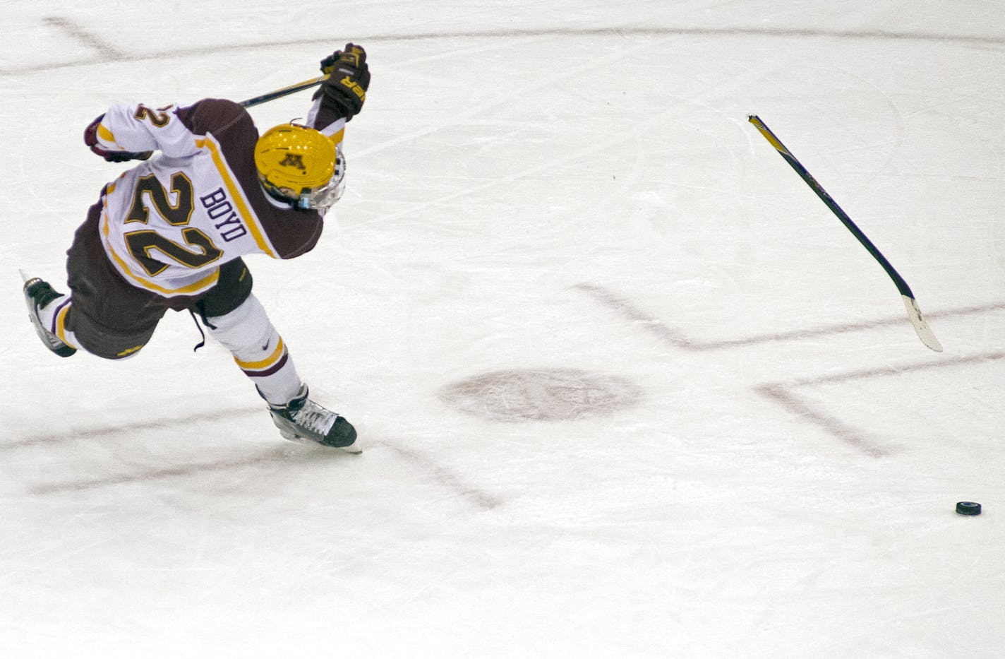 The stick of University of Minnesota center Travis Boyd (22) breaks as he attempts a snapshot against Wisconsin in the first period. ] (Aaron Lavinsky | StarTribune) The University of Minnesota Gophers hockey team plays against the Wisconsin Badgers on Friday, Jan. 16, 2015 at Mariucci Arena.