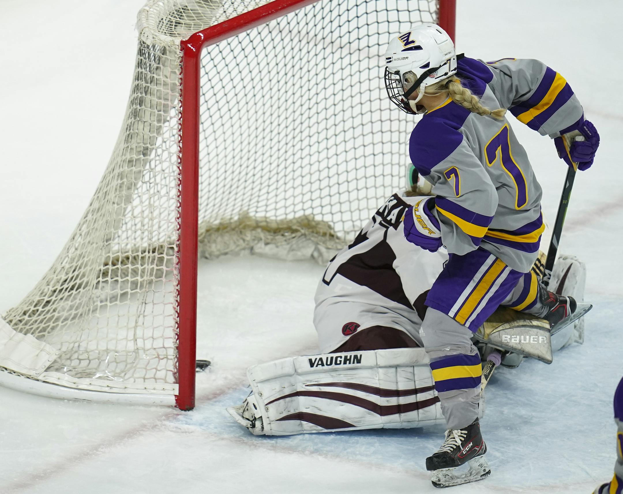 Rochester Lourdes' Emma Schmitzwing (7) stuffed the puck past South St. Paul Packers goaltender Delaney Norman at 53 seconds into overtime to give the Eagles the win. ] JEFF WHEELER • Jeff.Wheeler@startribune.com Rochester Lourdes squeaked past South St. Paul 2-1 in overtime in an MSHSL Girls' Hockey State Tournament Class A quarterfinal game Wednesday night, February 19, 2020 at Xcel Energy Center in St. Paul.