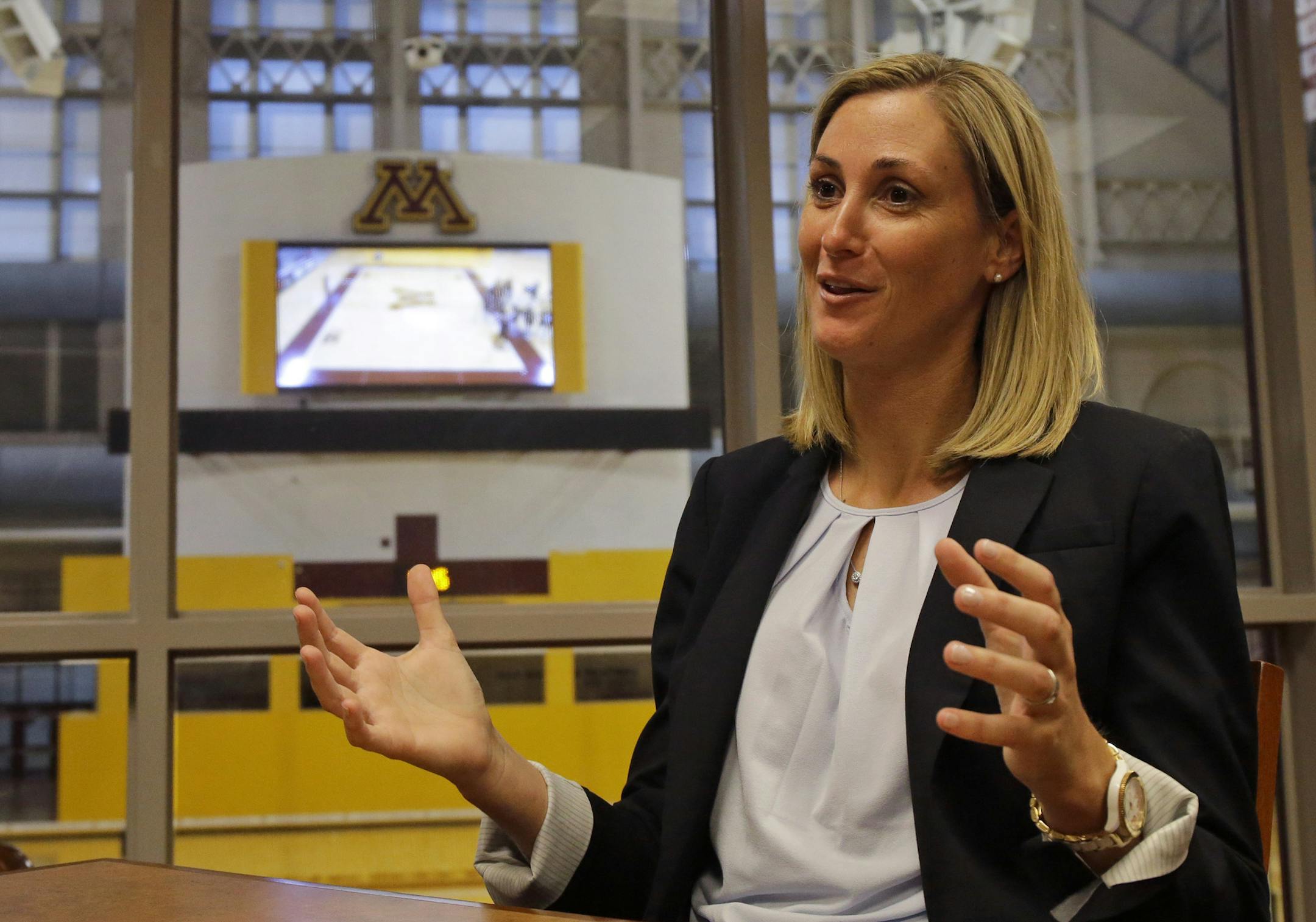 In this Monday, Aug. 10, 2015, photo, University of Minnesota interim athletic director Beth Goetz responds to a question during an interview in Minneapolis. Goetz has stepped into the chaos at Minnesota after athletic director Norwood Teague left amid sexual harassment allegations and is tasked with stabilizing a shaken department. (AP Photo/Ann Heisenfelt)