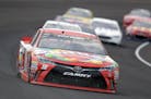 Winner Kyle Busch drove through the first turn during the Brickyard 400 at Indianapolis Motor Speedway on Sunday.