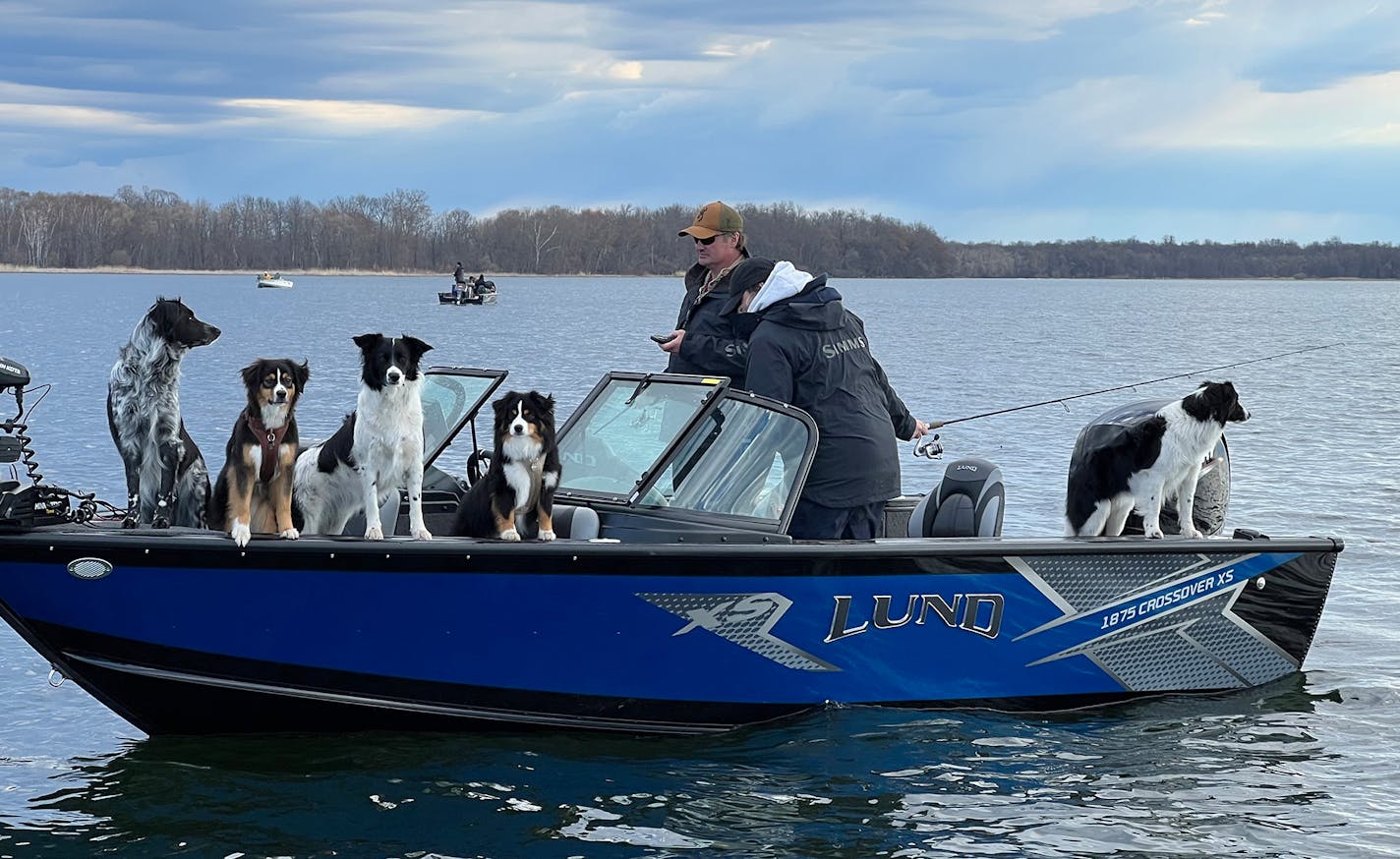 Fishing with dogs, as this couple did, was a common sight on Lake Winnibigoshish Saturday morning. This many dogs was uncommon, however.