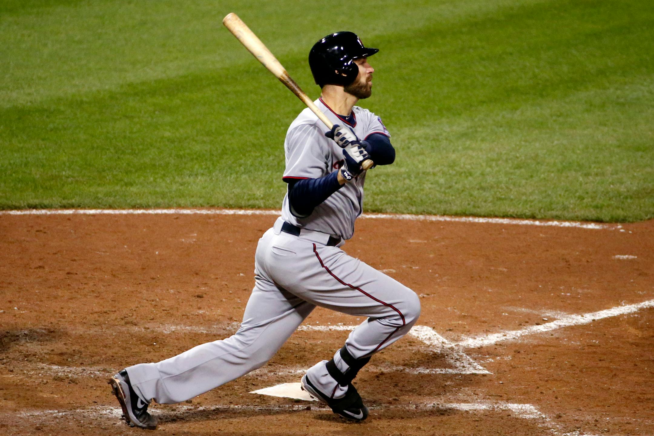 Minnesota Twins' Joe Mauer (7) watches his solo-home run off Pittsburgh Pirates relief pitcher Antonio Bastardo during the thirteenth inning of a baseball game in Pittsburgh Wednesday, May 20, 2015. The Twins won 4-3. (AP Photo/Gene J. Puskar)