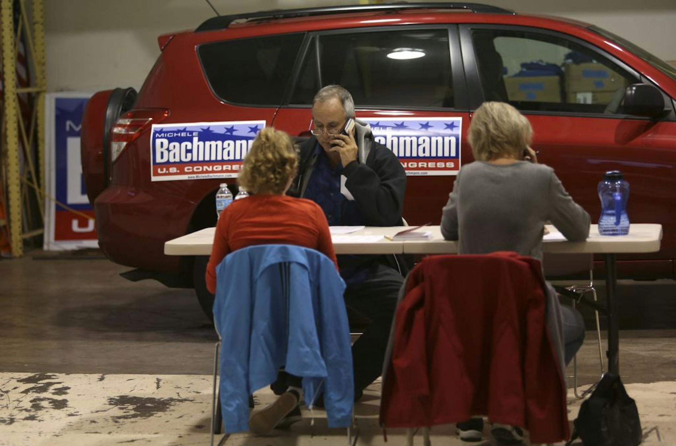 Bachmann volunteers Jim Bendtsen, along with Anita Saxon and daughter Emily, 11, surveyed voters.