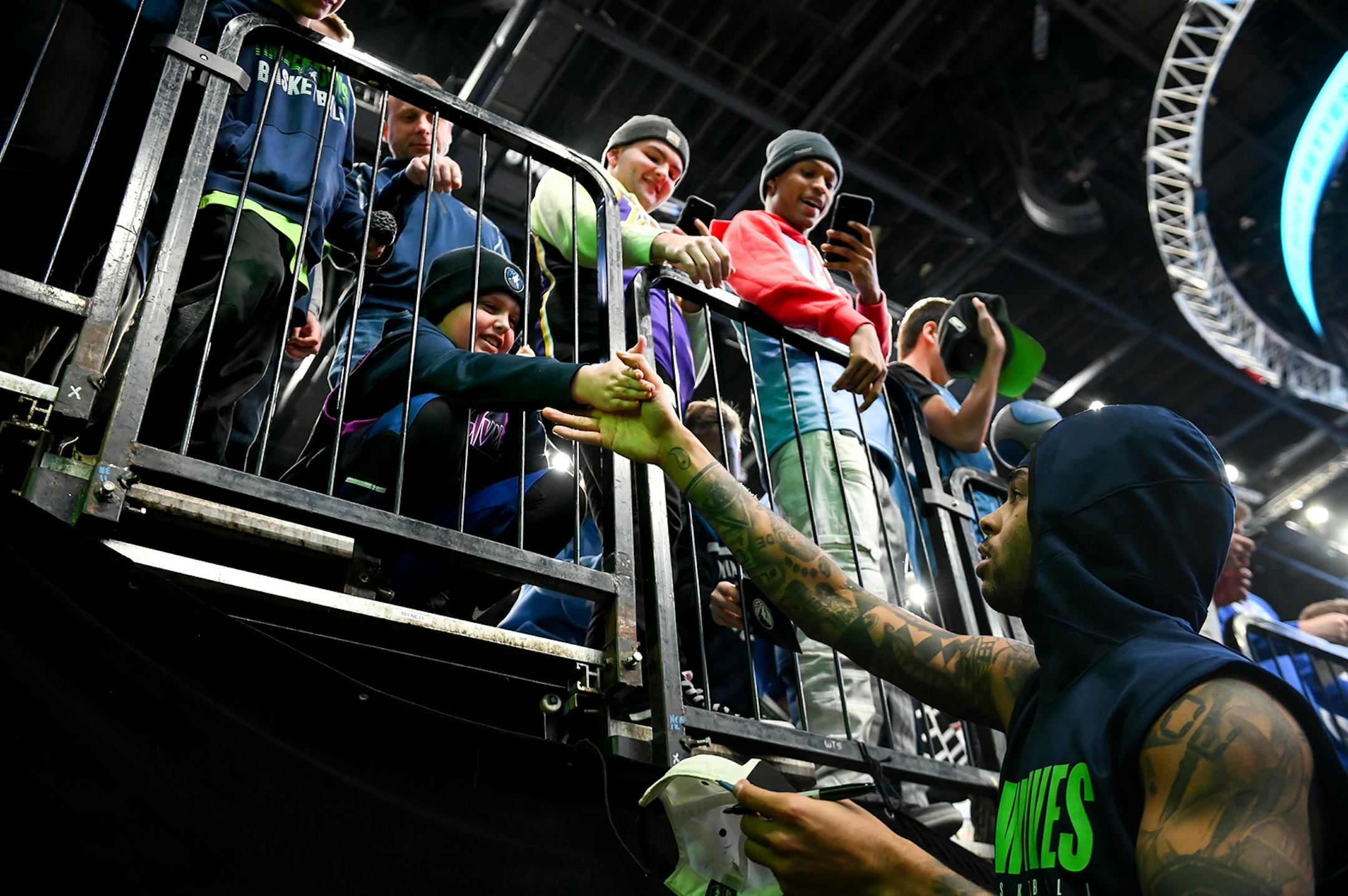 Minnesota Timberwolves guard D'Angelo Russell (0) signed autographs for fans before Saturday's game against the LA Clippers.