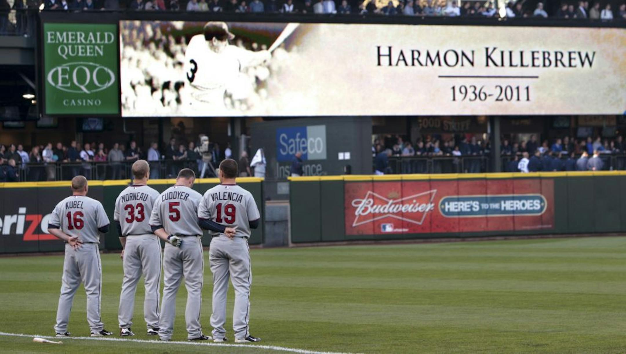 Twins players stand along the third base line during a moment of silence to honor Hall of Famer Harmon Killebrew before Tuesday's game against the Seattle Mariners.