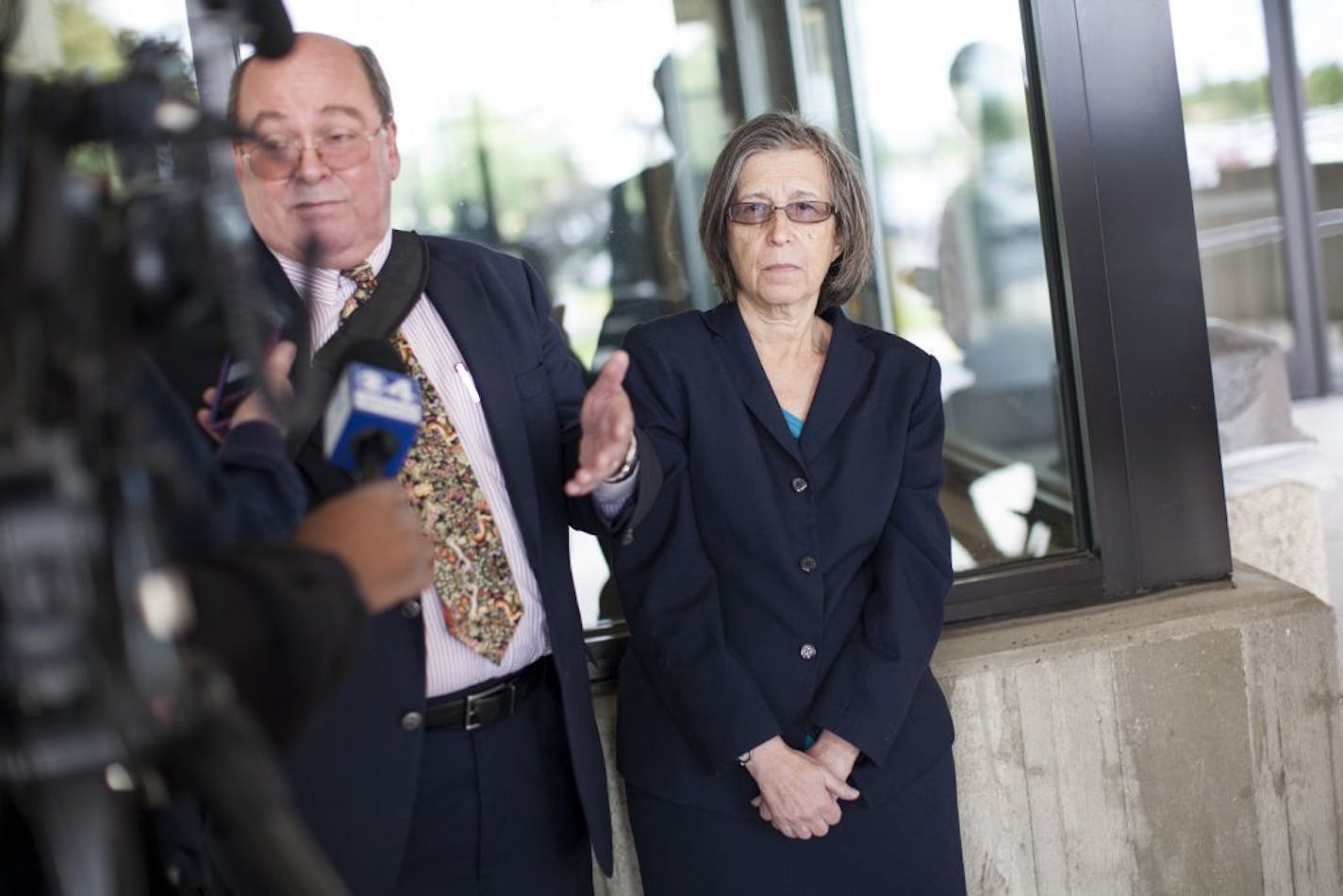 Defense attorney Robert Rivas, left, and Janis Landis, president of Final Exit Network, talk with the media after the sentencing of Final Exit Network in the case of the assisted suicide death of Doreen Dunn at the Dakota County Judicial Center in Hastings August 22, 2015.