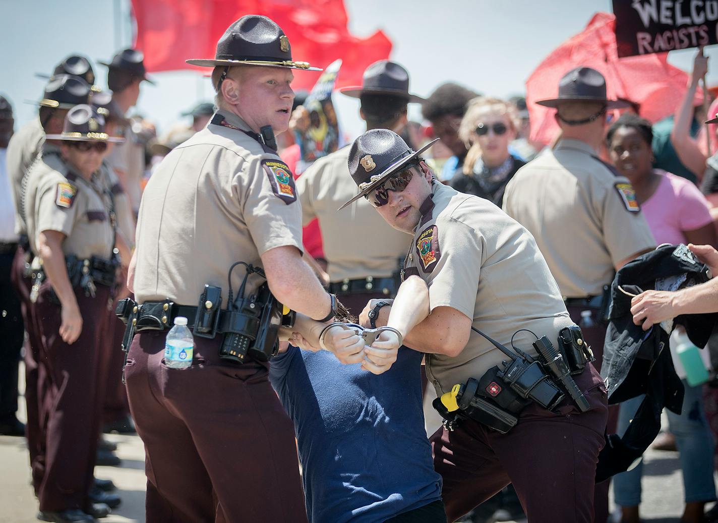 An anti-Sharia law group and antifascist protesters clashed during dueling rallies at the Minnesota State Capitol, Saturday, June 10, 2017 in St. Paul, MN. When a small faction of the anti-sharia group challenged the protesters outside, the Minnesota State Patrol had to intervene. ] ELIZABETH FLORES � liz.flores@startribune.com