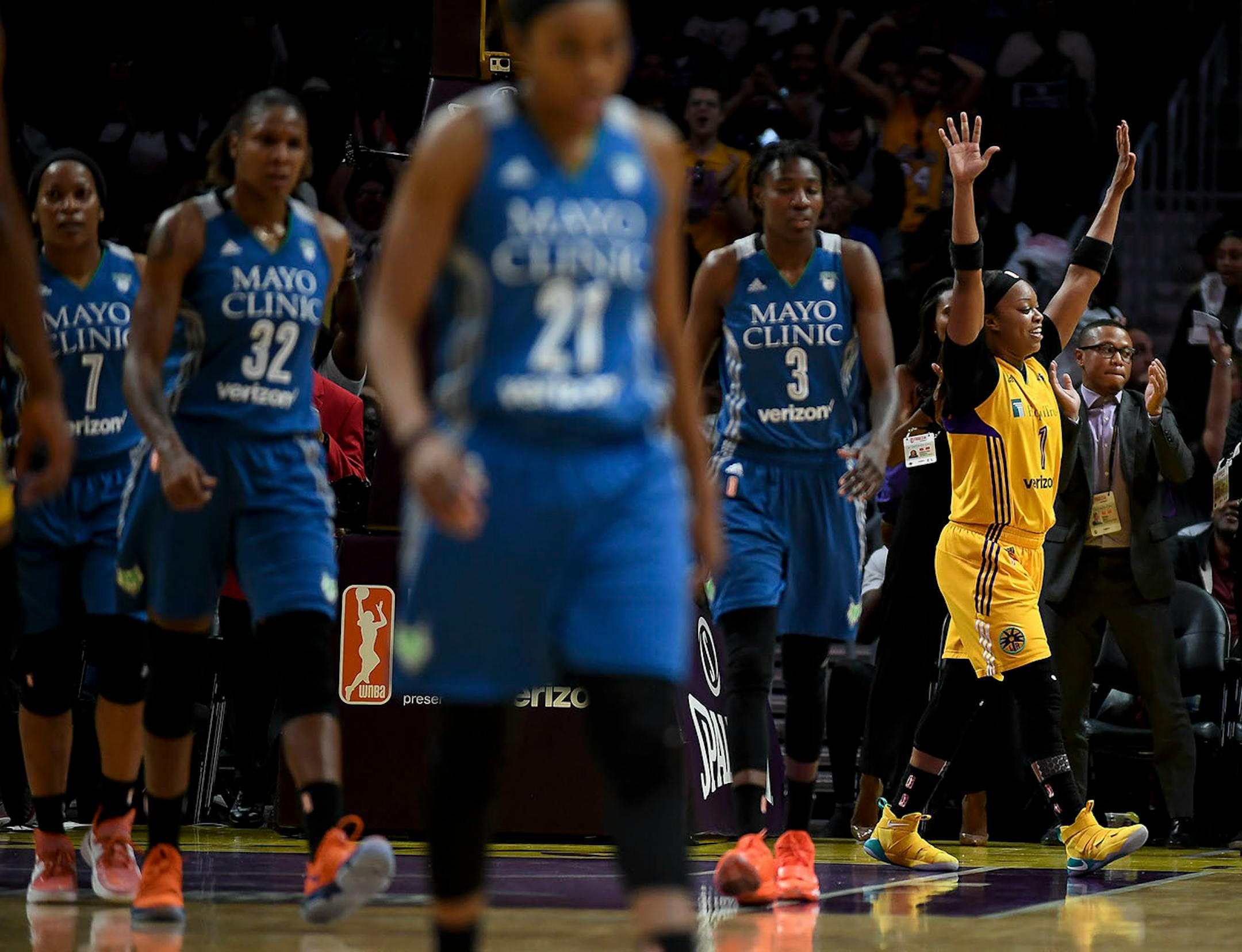 Los Angeles Sparks guard Odyssey Sims (1) celebrated after a buzzer beating layup by Sparks guard Alana Beard (0) to end the first quarter Sunday.