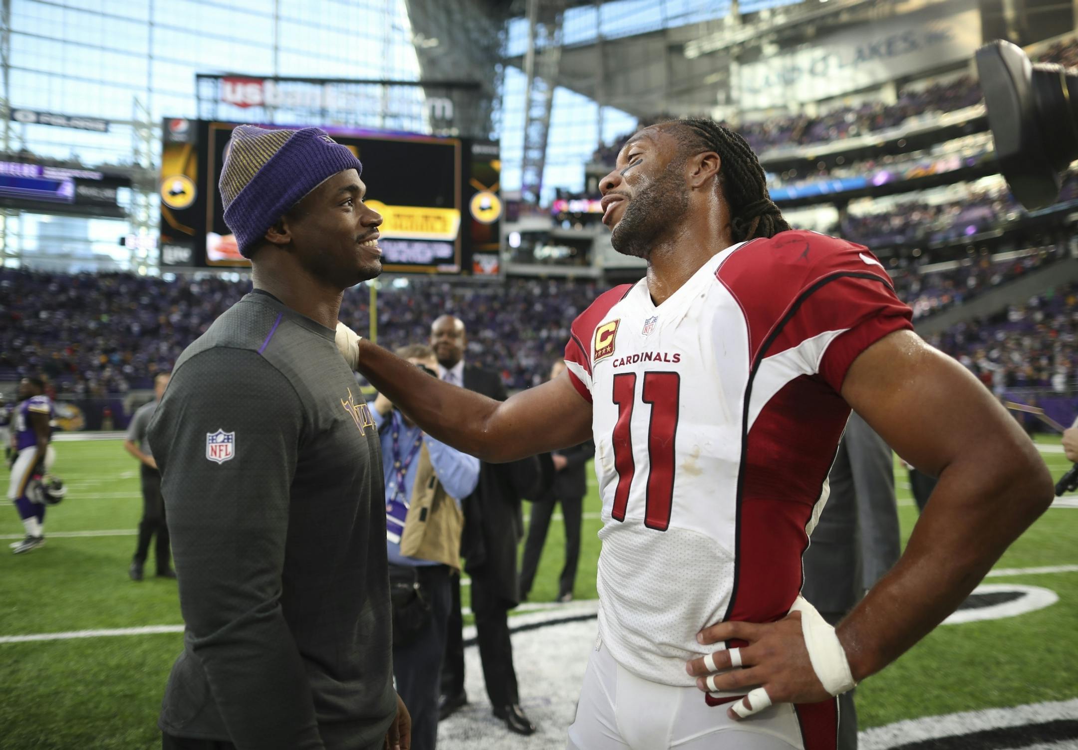 Injured Vikings running back Adrian Peterson said hello to Arizona Cardinals wide receiver and Minneapolis native Larry Fitzgerald in November at U.S. Bank Stadium.