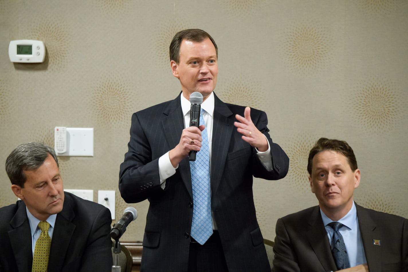 Hennepin County Commissioner Jeff Johnson. On the left Former GOP State Chairman Keith Downey, on the right, is State Rep. Matt Dean.