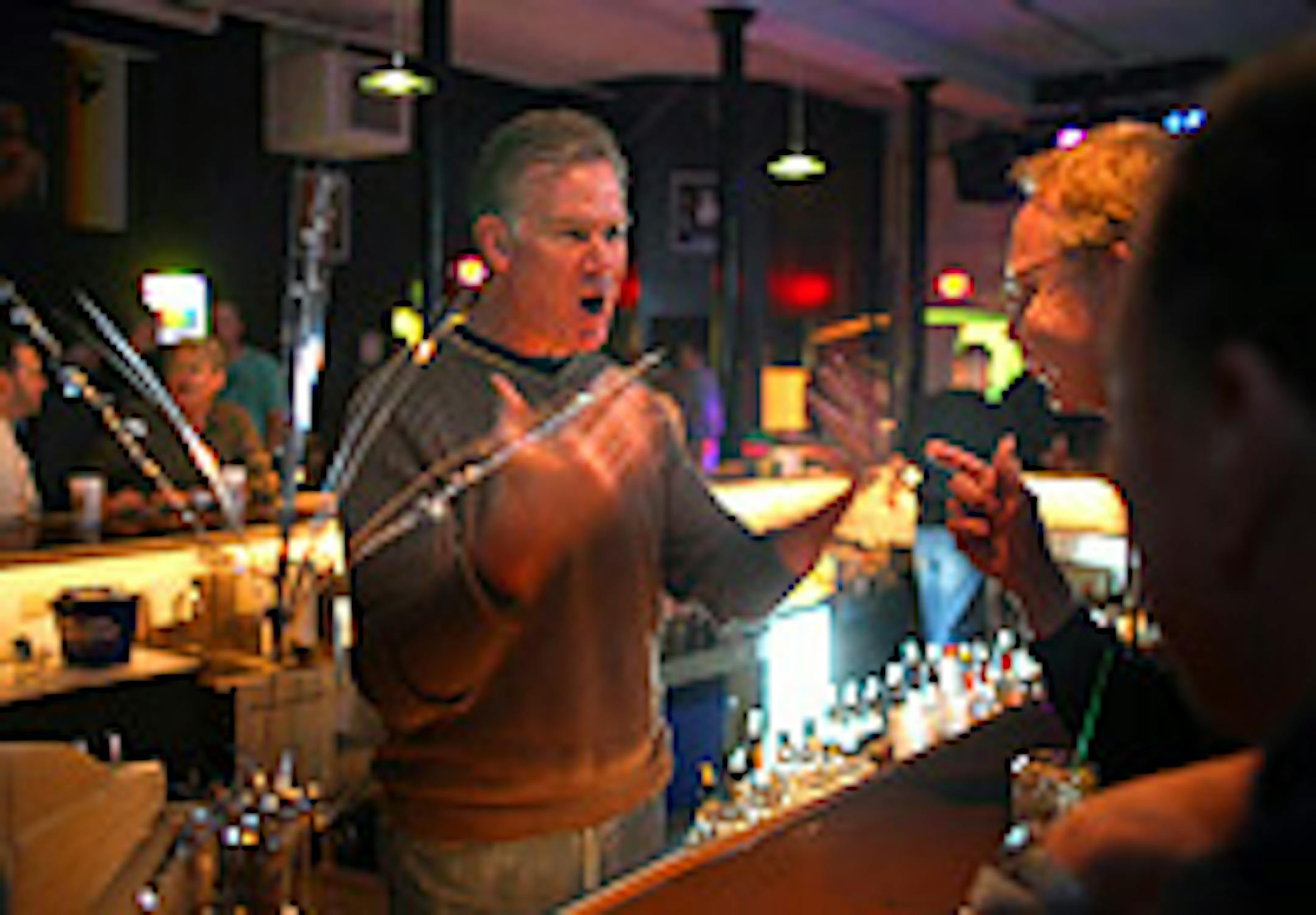 St. Paul Mayor Chris Coleman brought back some old skills and help bartend at Rumours on Grand opening night.