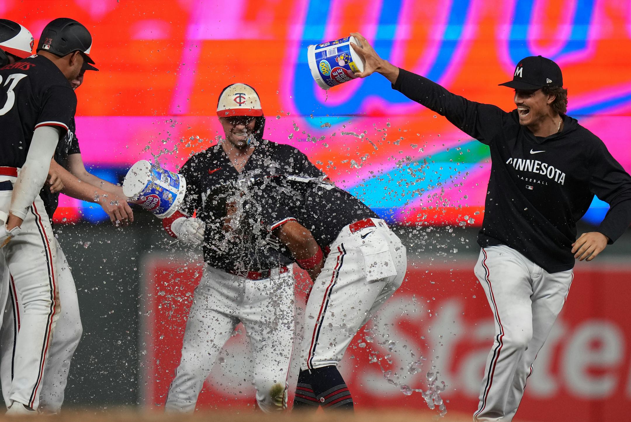 Minnesota Twins left fielder Willi Castro (50) gets water bucket victory after hitting a sacrifice fly to score Minnesota Twins catcher Ryan Jeffers (27) for the winning run in Minneapolis, Minn., on Thursday, June 1, 2023.