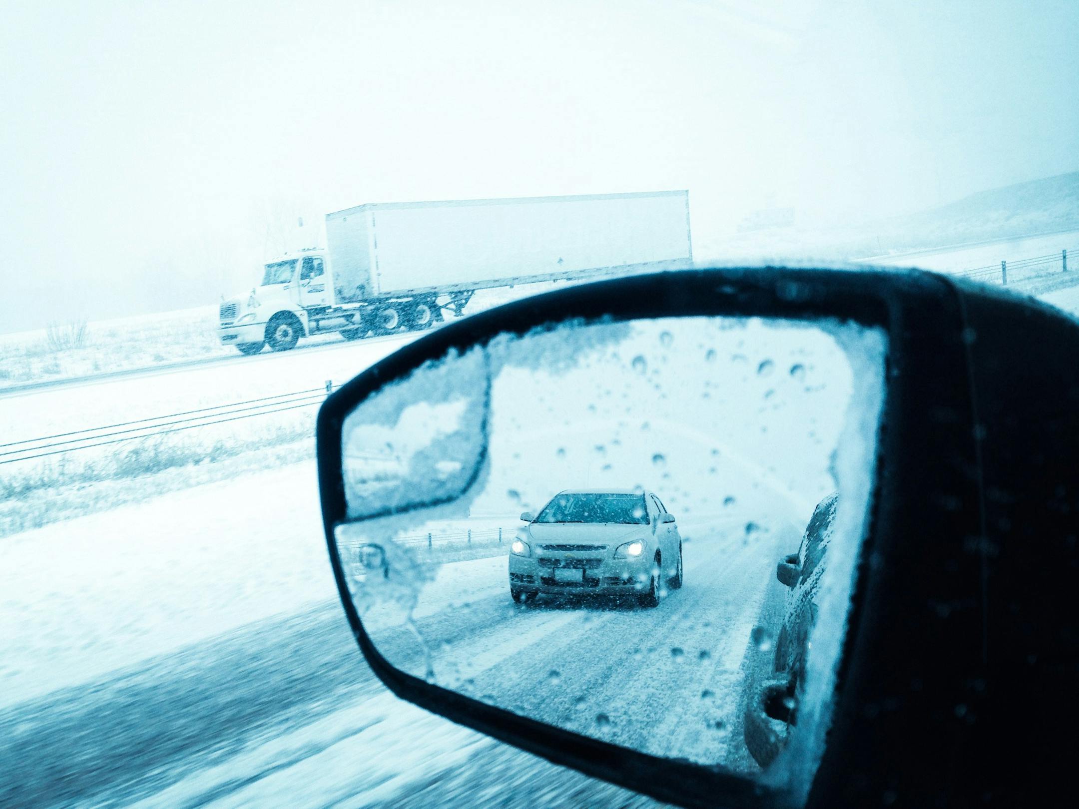 Snow and ice coat I-94 near Monticello, Minn., after a storm dumped unwelcome precipitation across much of Minnesota on Wednesday, April 16, 2014.