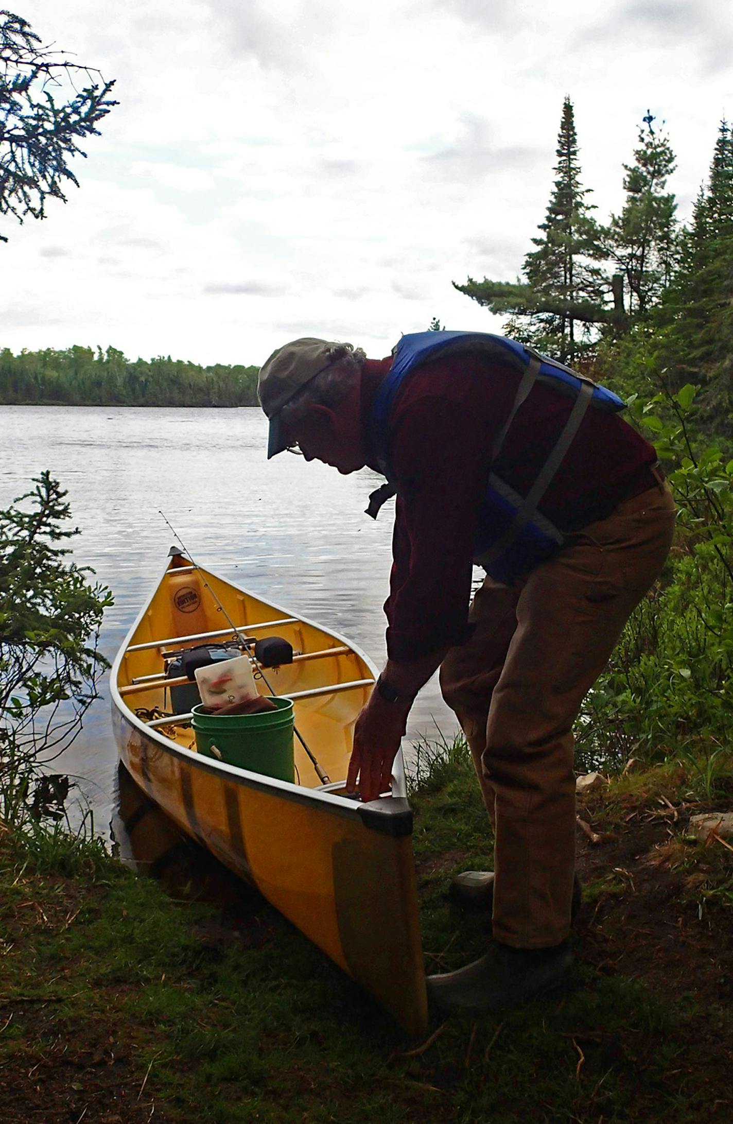 Shawn Perich of Hovland, Minn., north of Grand Marais, Minn., prepared a canoe for an evening's fishing last week in the Boundary Waters Canoe Area Wilderness.