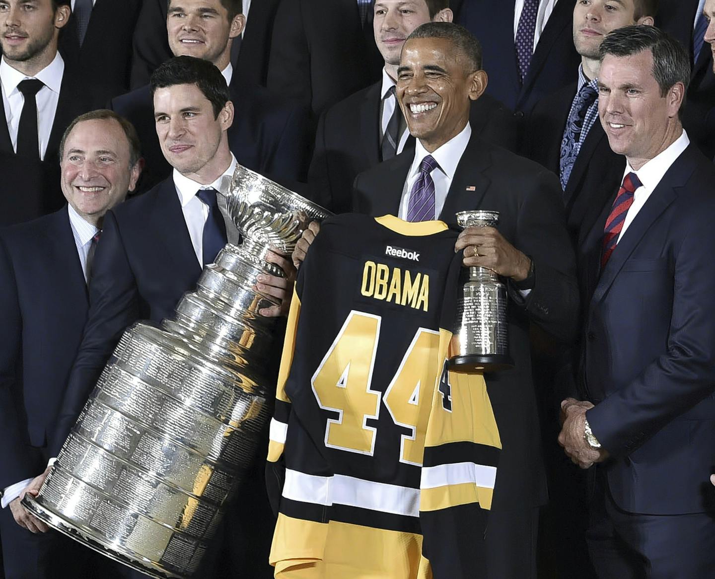 Sidney Crosby, of the Stanley-Cup-winning Pittsburgh Penguins hockey team, poses alongside U.S. President Barack Obama, NHL commissioner Gary Bettman and Penguins coach Mike Sullivan during a reception at the White House, in Washington, Thursday, Oct. 6, 2016, to mark the team's 2016 Stanley Cup win. (Matt Freed /Pittsburgh Post-Gazette via AP)