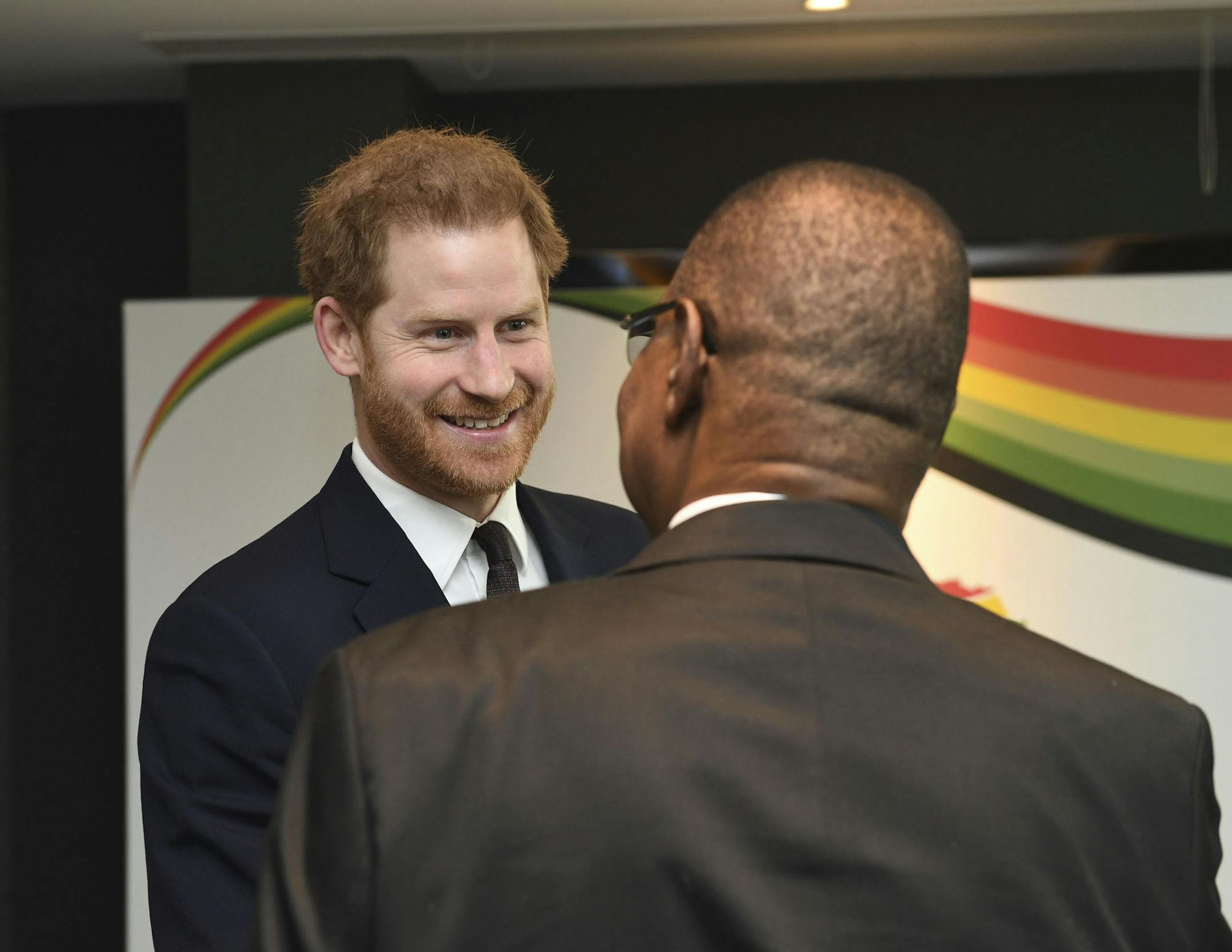 Britain's Prince Harry meets with President of Malawi, Arthur Peter Mutharika, right, at the UK Africa Investment Summit in London, Monday Jan. 20, 2020. Britain's Prime Minister Boris Johnson is hosting 54 African heads of state or government in London, as the U.K. prepares for post-Brexit dealings with the world. (Stefan Rousseau/Pool via AP)