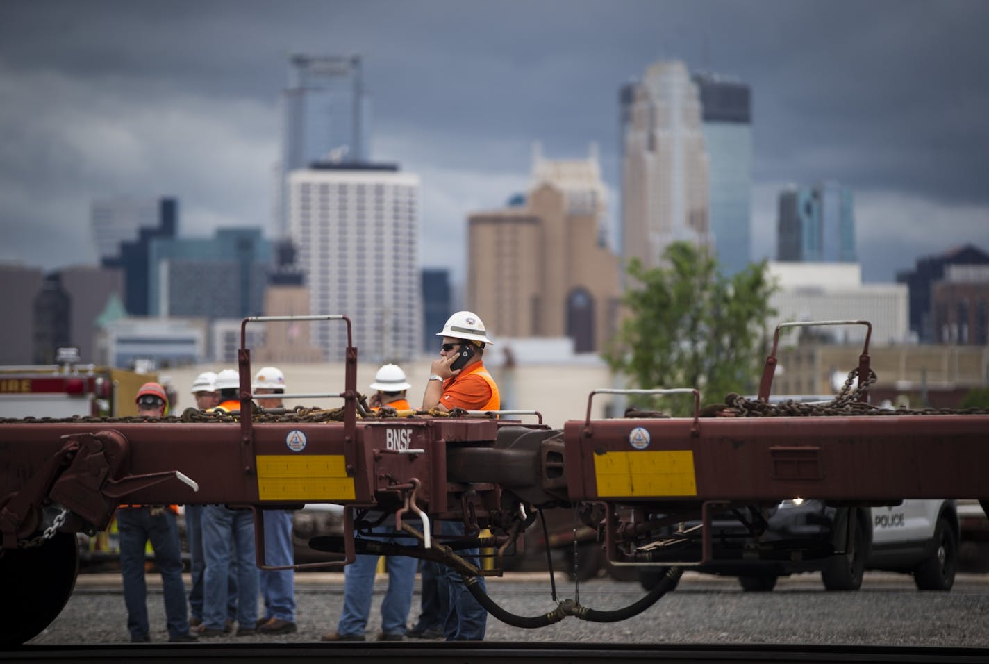 Rail workers at the scene of a fatal incident involving a train at BNSF Railway on Harrison St. in Minneapolis, Minn. on Monday, May 25, 2015.