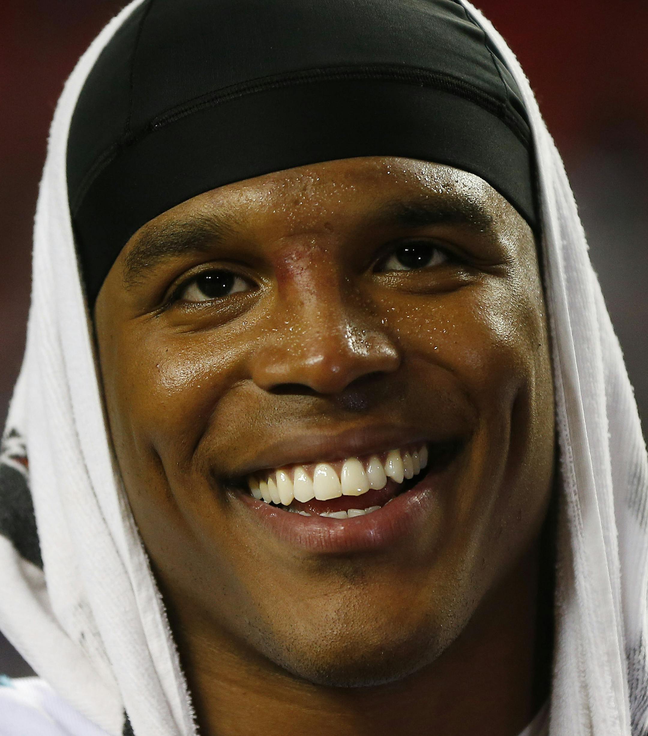 Carolina Panthers quarterback Cam Newton (1) stands on the sidelines during the second half of an NFL football game against the Atlanta Falcons, Sunday, Dec. 28, 2014, in Atlanta. (AP Photo/John Bazemore) ORG XMIT: GAMS1