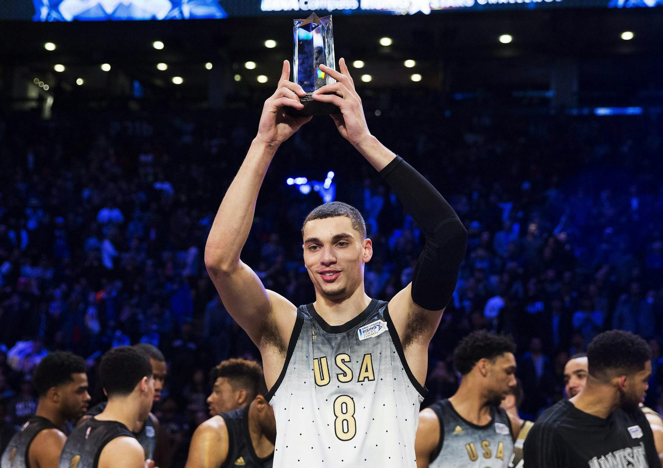 United States player Zach LaVine holds the MVP trophy after the NBA Rising Stars Challenge basketball game in Toronto, Friday, Feb. 12, 2016. (Mark Blinch/The Canadian Press via AP) MANDATORY CREDIT