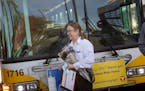 Transit employees greeted Melanie Benson with flowers and a plaque at one of her stops celebrating her anniversary, Monday, October 11, 2021 between M