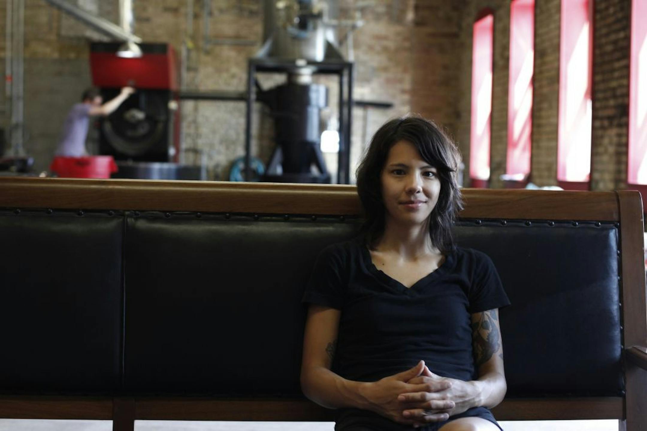 Director of coffee Stephanie Ratanas sits on a comfy couch in the office, lounge, and coffee bean roasting facility of Dogwood Coffee Co. in Minneapolis, Minn. on Tuesday, July 13, 2012.