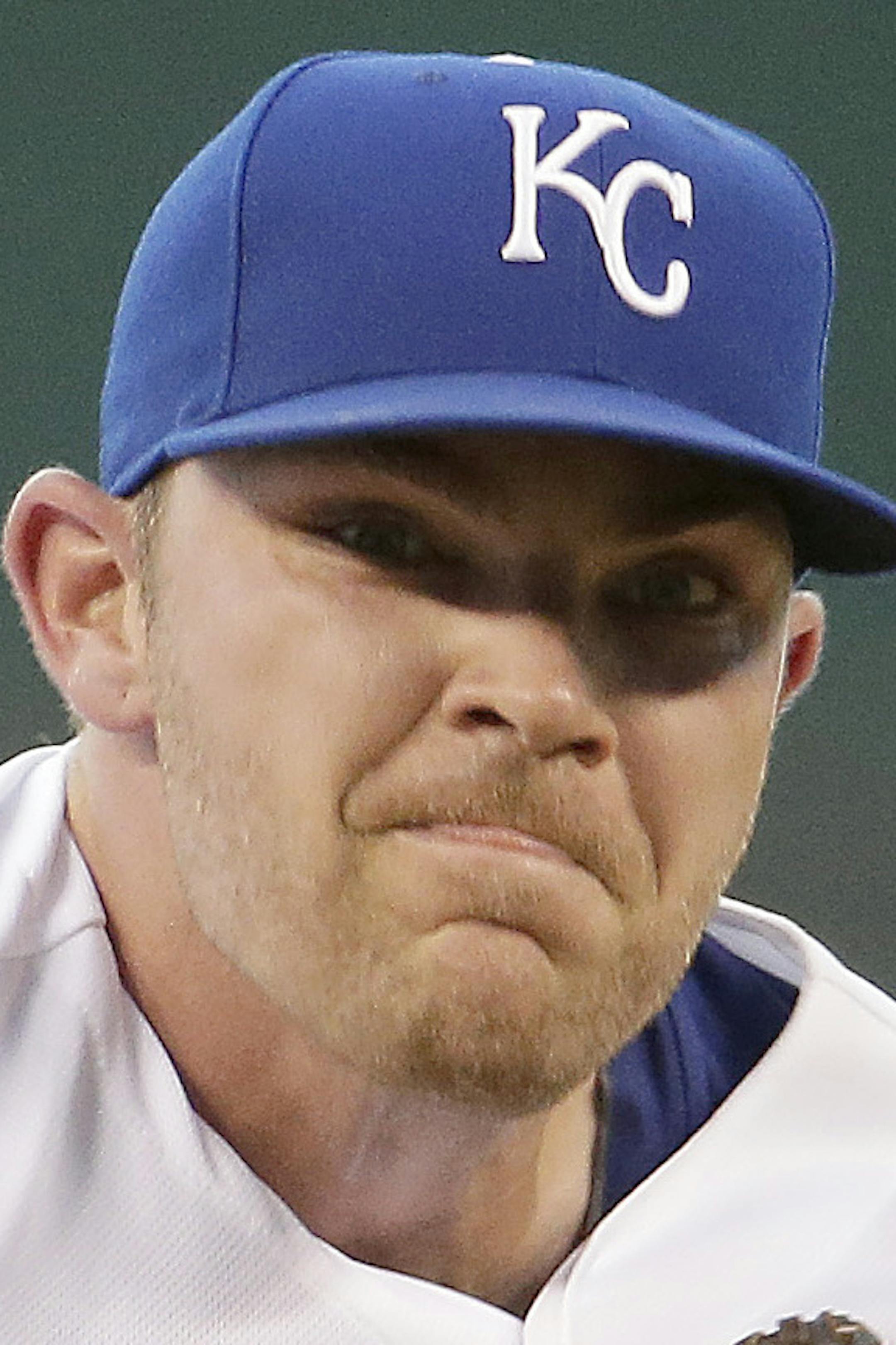 CORRECTS PITCHER TO LIAM HENDRIKS, INSTEAD OF PHIL HUGHES - Kansas City Royals starting pitcher Liam Hendriks throws during the first inning of a baseball game against the Minnesota Twins on Wednesday, Aug. 27, 2014, in Kansas City, Mo. (AP Photo/Charlie Riedel)