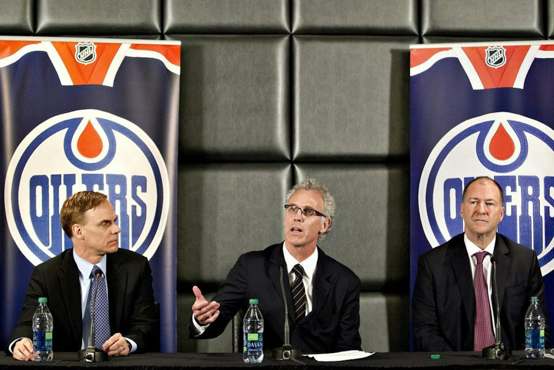 Edmonton Oilers new senior vice-president Scott Howson, left, new general manager Craig MacTavish, center, and team president Kevin Lowe attend a press conference in Edmonton, Alberta, on Monday April 15, 2013.