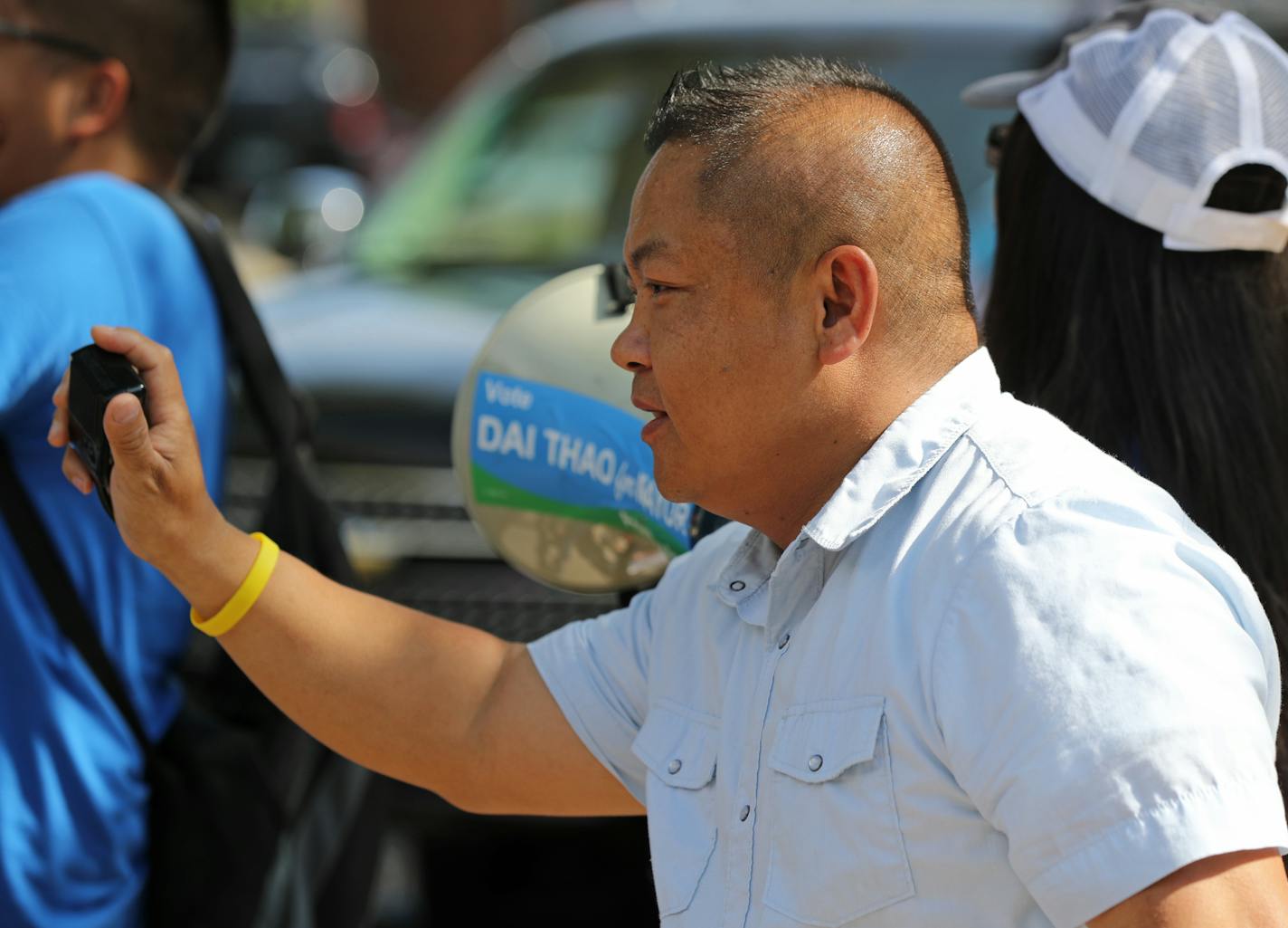 St. Paul mayoral candidate Dai Thao spoke to volunteers before the start of the Payne Arcade Harvest Festival and Parade. ] Shari L. Gross &#xef; shari.gross@startribune.com Profile of St. Paul mayoral candidate Dai Thao. Dai Thao at a parade on Payne Ave in St. Paul. Something tight of his face and then something of Thao in action.