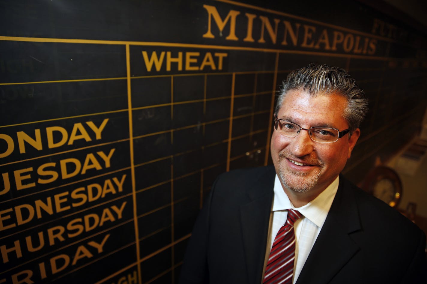 Mark Bagan is the CEO of the Minneapolis Grain Exchange. Behind him is the old commodity chalk board which he saved from the garbage heap. The Minneapolis Grain Exchange is one of the Twin Cities' oldest business institutions, and while the commodity exchange business is consolidating everywhere, it remains independent. Trading in its signature contract -- hard red spring wheat -- is strong, but a new rival spring wheat contract has been launched in Canada along with the deregulation of that cou