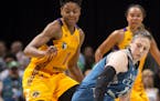 Los Angeles Sparks guard Alana Beard (0) knocked the ball loose while defending Minnesota Lynx guard Lindsay Whalen (13) in the second quarter Friday 