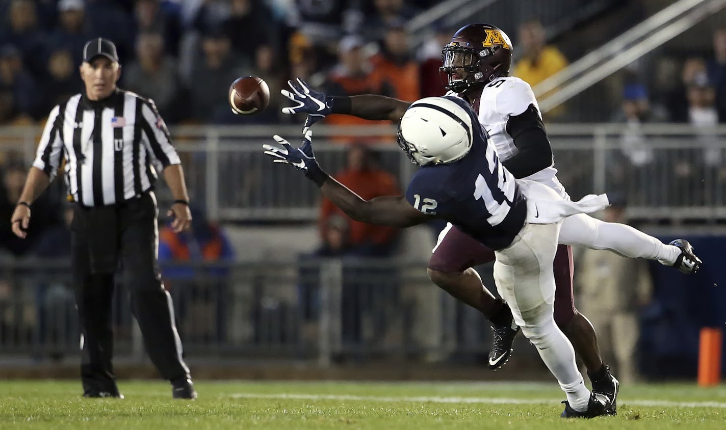 Penn State's Chris Godwin (12) makes a diving catch in front of Minnesota's Jalen Myrick (5) during the second half of an NCAA college football game in State College, Pa., Saturday, Oct. 1, 2016. (AP Photo/Chris Knight)