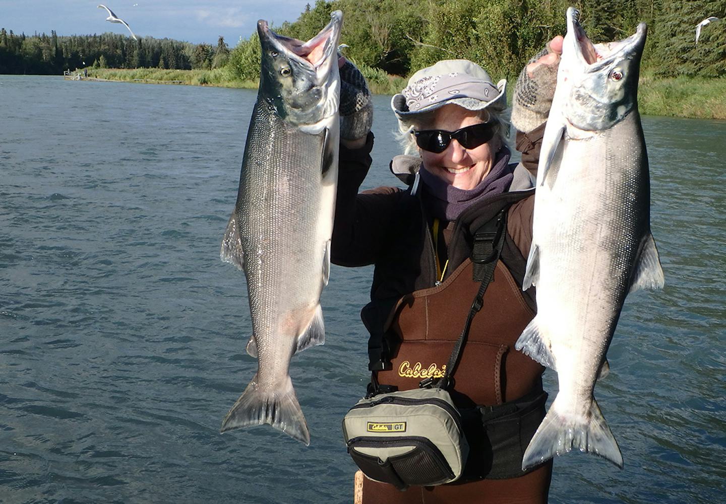 Rita Balcerzak of White Bear Lake with two male sockeyes, for Outdoors Weekend.